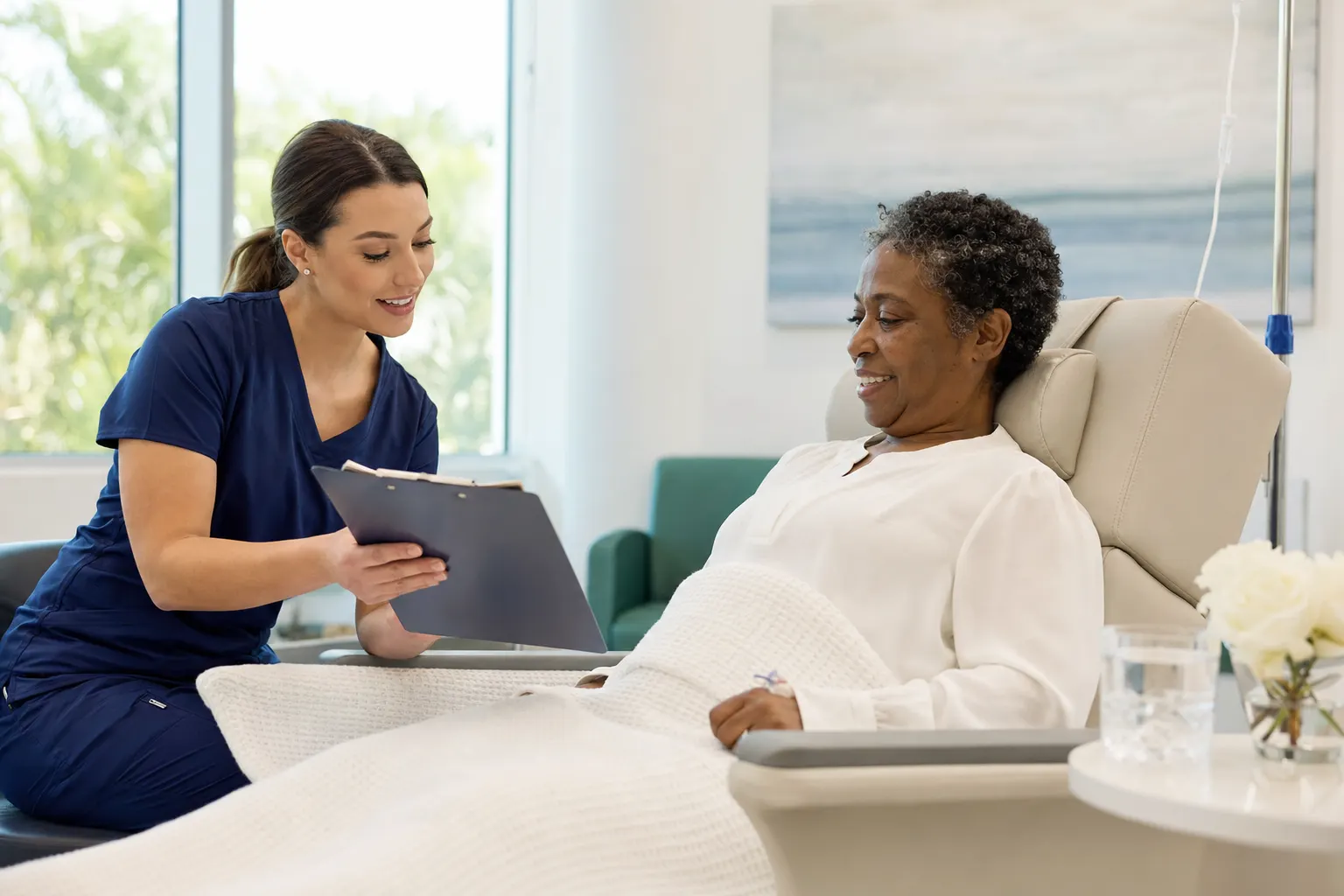 A nurse reviewing discharge instructions with a patient in the recovery area
